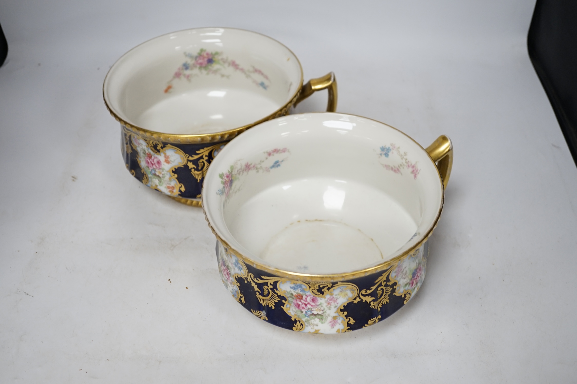 D. & C. Limoges, France, a pair of late 19th / early 20th century chamber pots, 21cm diameter. Condition - fair, some wear